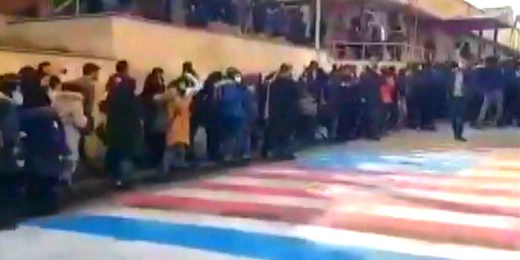 WATCH: Iranian protestors refuse to trample US/Israel flags - Nine Line Apparel